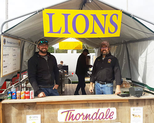 Lions selling food at the fair
